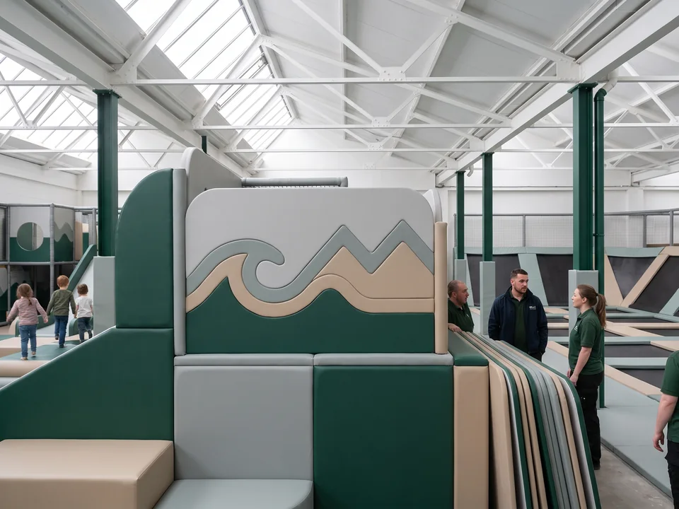 CNC-cut HDPE theme panel with a wave and mountain line motif