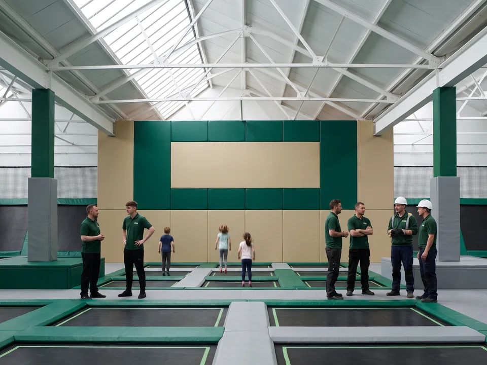 Trampoline wall pad in theme colors with a blank logo area