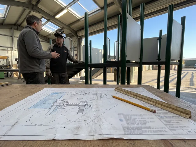 A printed 2D site plan with structure footprints, use zones and age zones