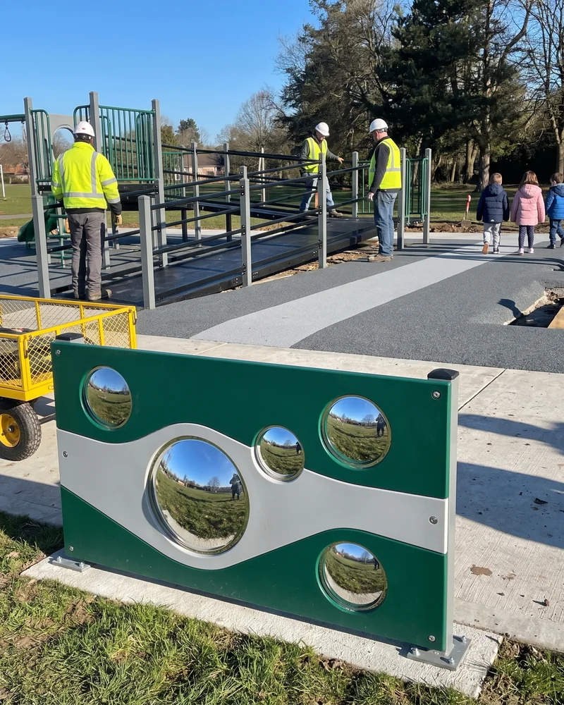 An HDPE panel with safety mirror surfaces reflecting the sky