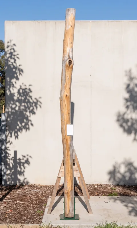 Timber piece L1-002, a Robinia upright, photographed with its part tag before loading