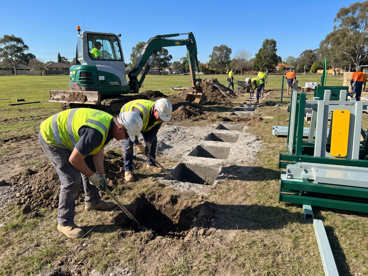 A crew setting out points with string lines and digging to the marked lines