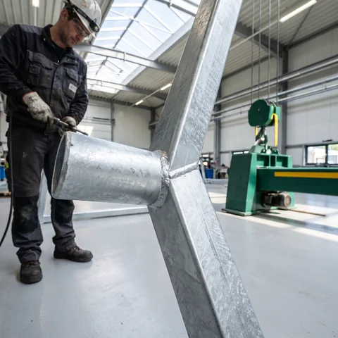 A freshly galvanized frame with a silver zinc spangle
