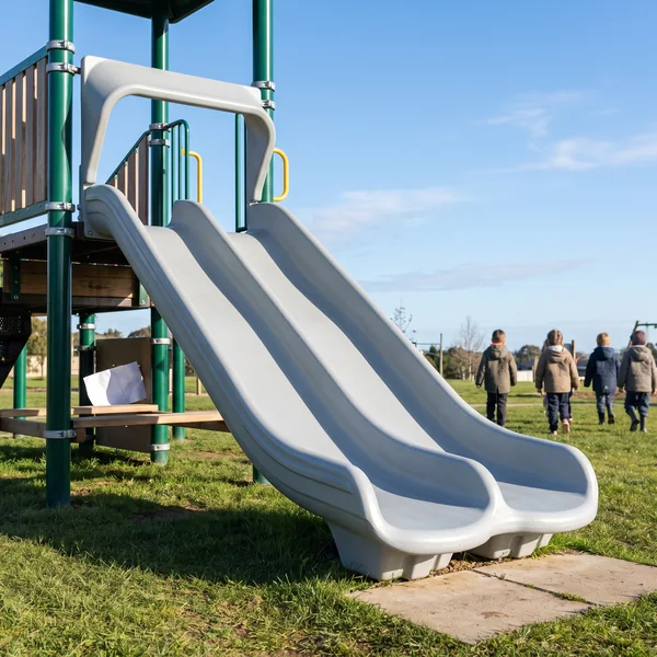A grey double-lane wave slide leaving one wide deck opening