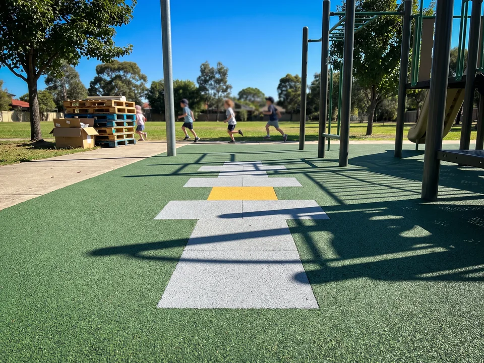 Hopscotch inlaid in poured-in-place surfacing, low oblique view
