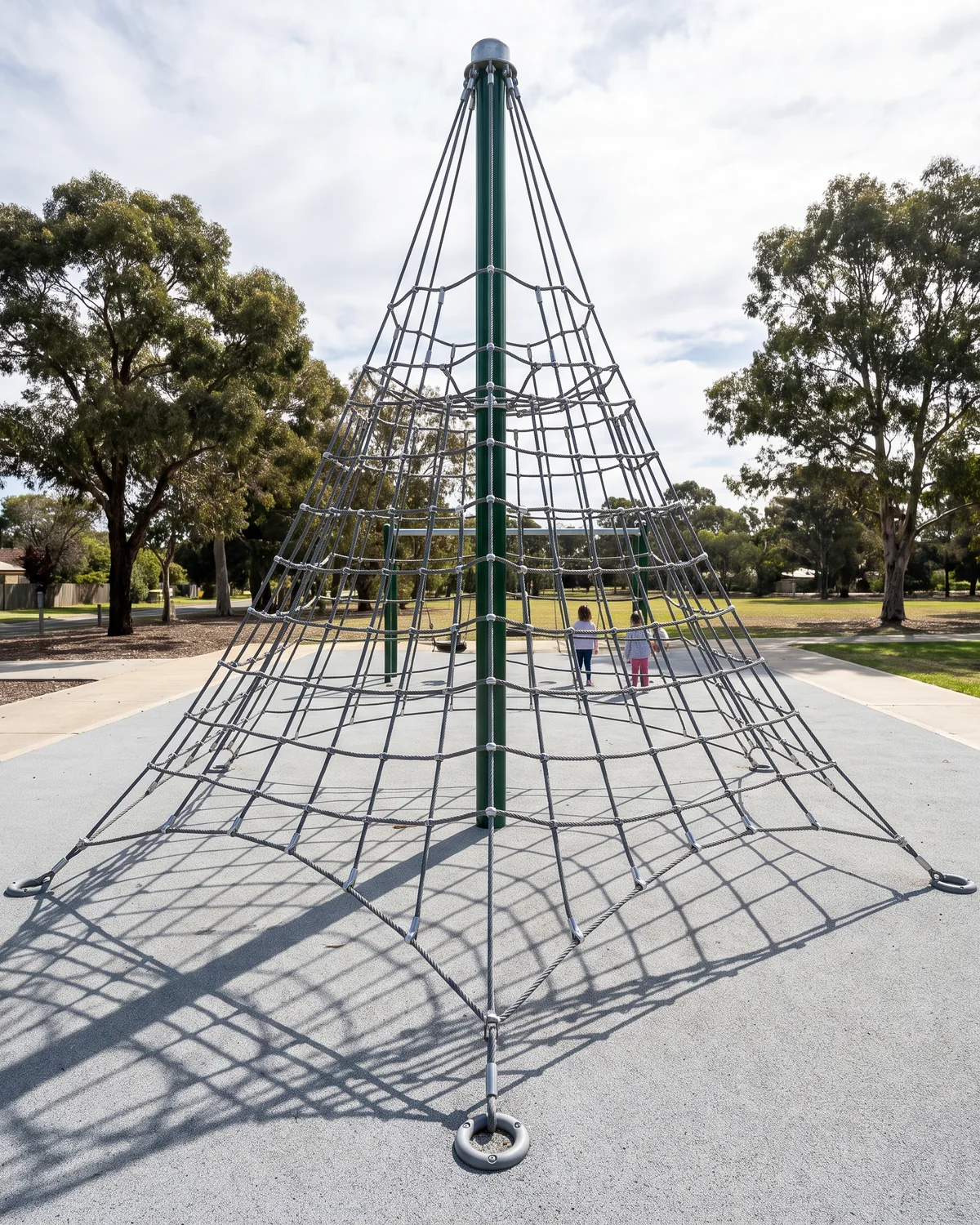 A tower space net on a single center mast in a public park, climbed from every side