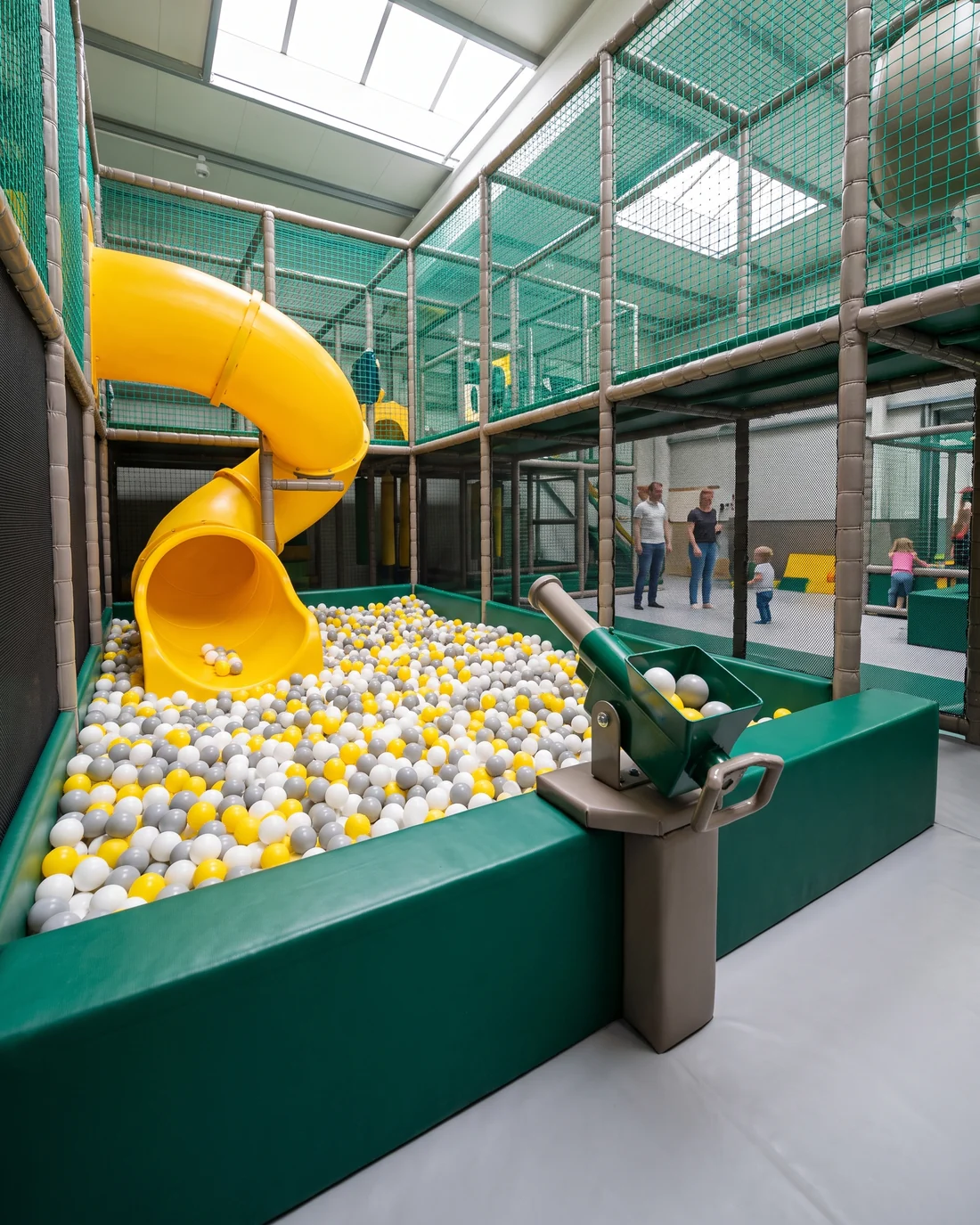 Older-child ball pit at the base of a slide