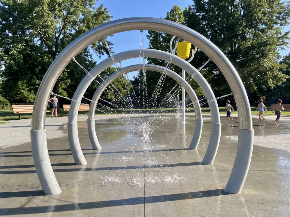 A spray tunnel made of three stainless arches with a line of fine nozzles along the inside
