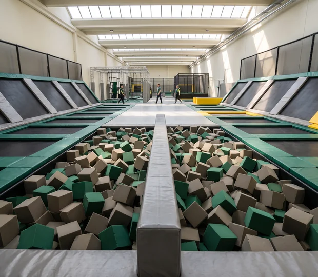 Padded battle beam set across a foam pit