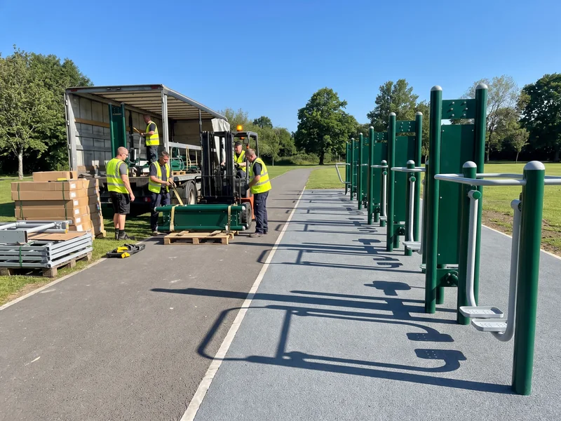 Outdoor fitness stations on a park path